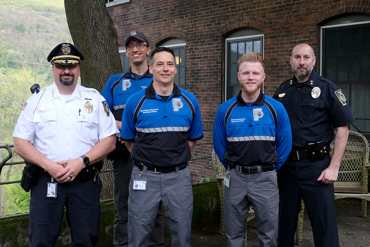 A photo of the 2026 BRAT unit alongside Chief Evans and Assistant Chief Petlock.