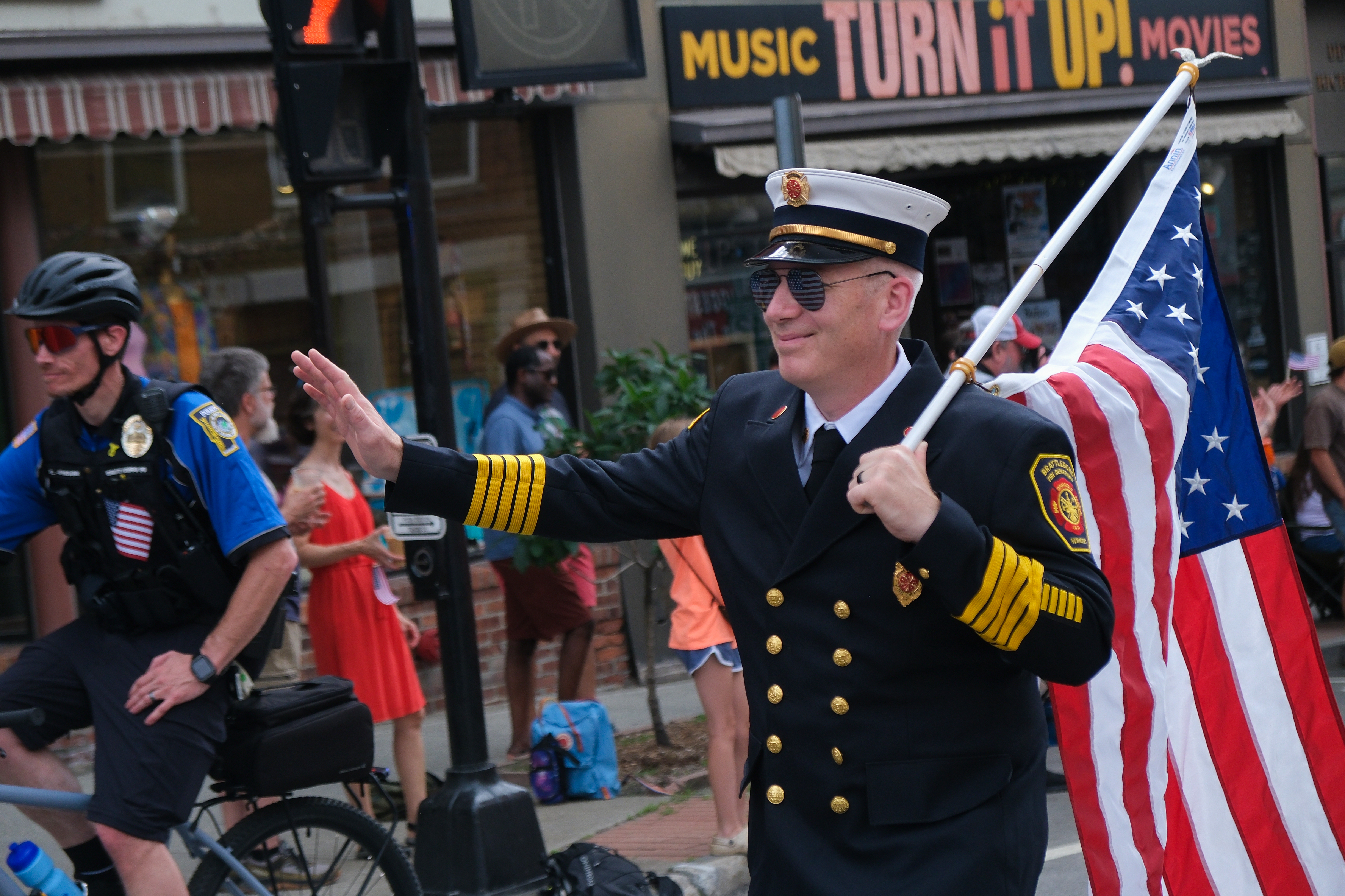 A photo of Fire Chief Jay Symonds walking through Downtown Brattleboro during a parade.