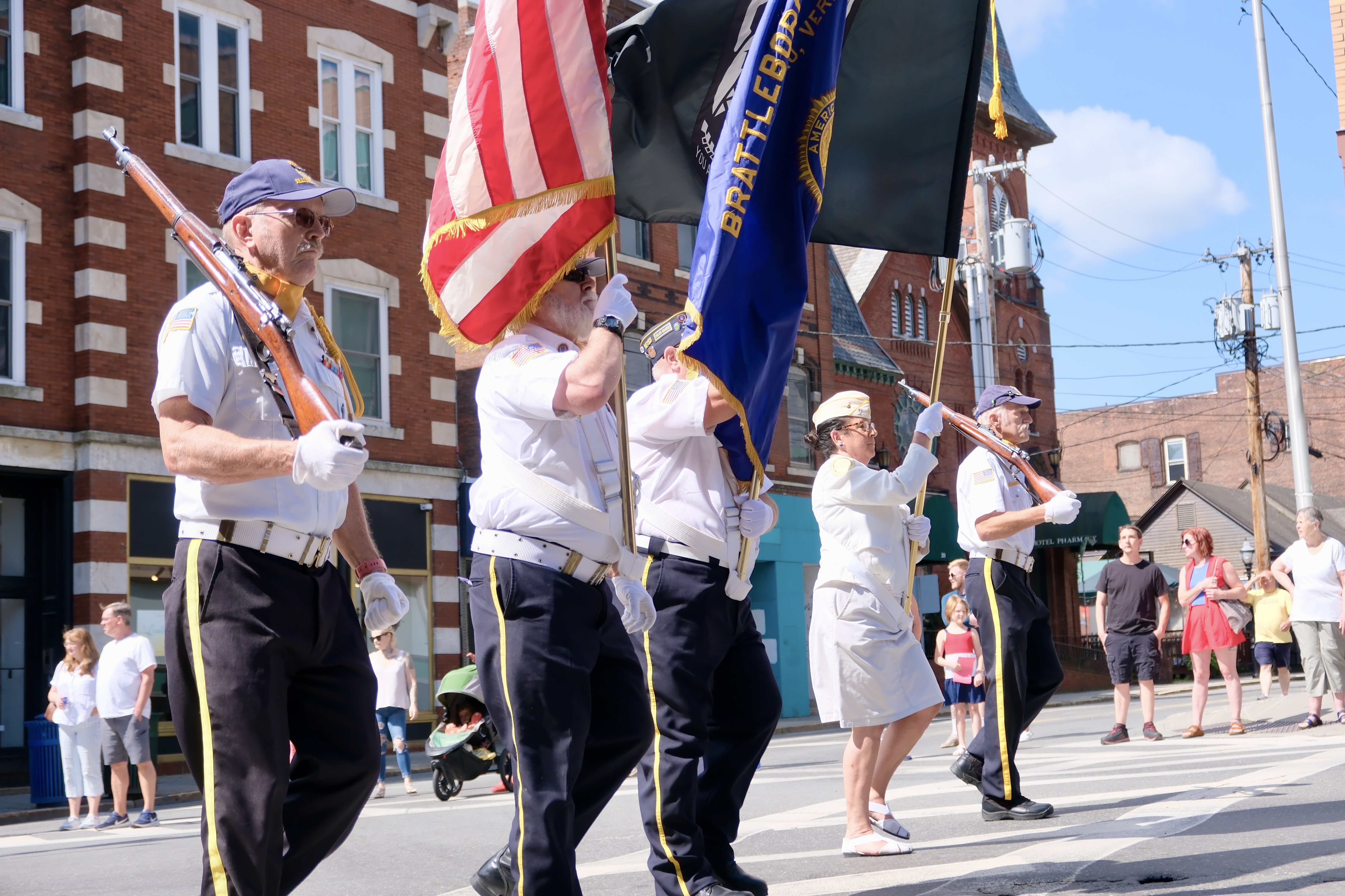 A group of veterans participate in a Fourth of July parade.