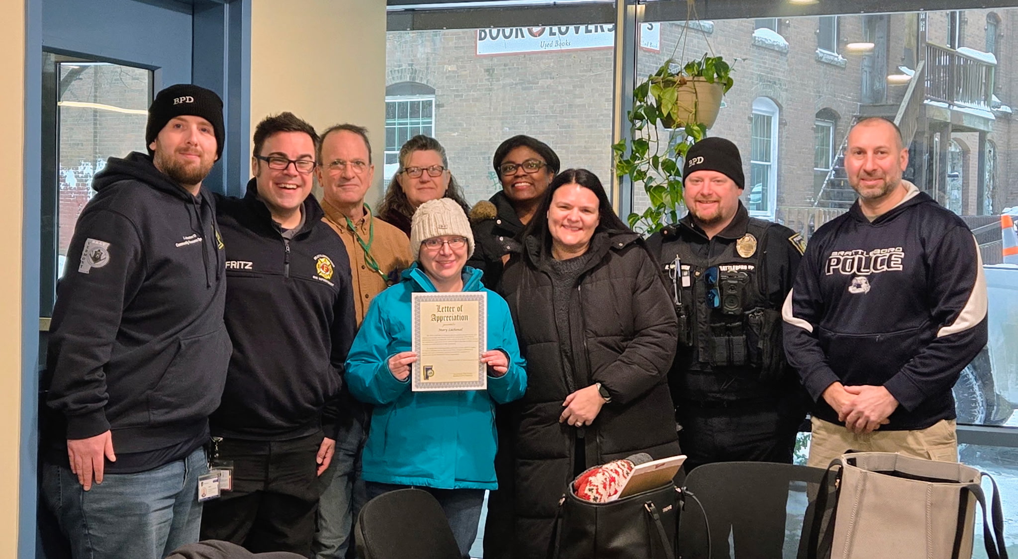 A photo of Mary Lachenal accepting the Community Partner Award. 