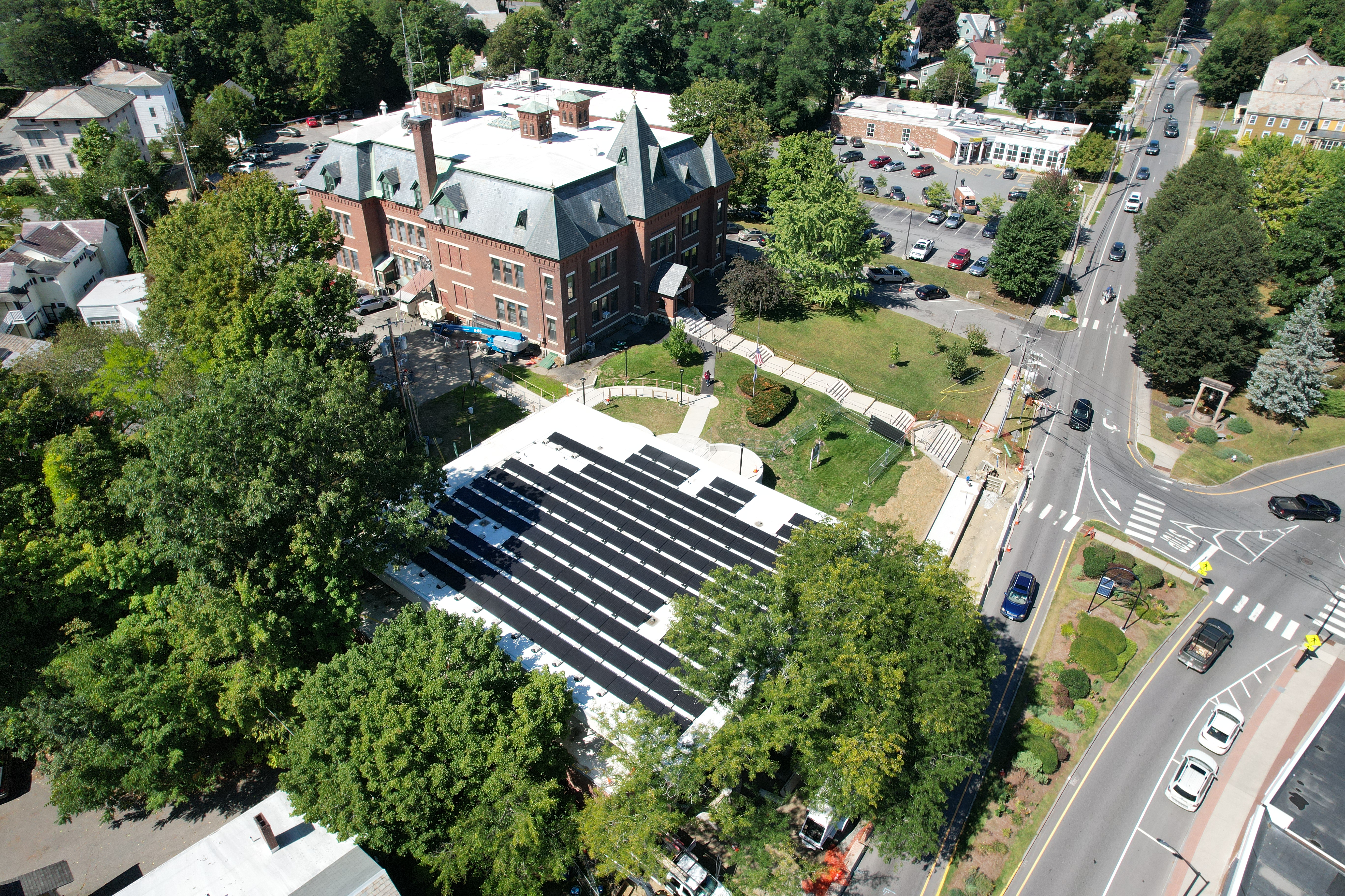 An aerial photo of the library's solar array, with the Brattleboro Municipal Center featured in the background.